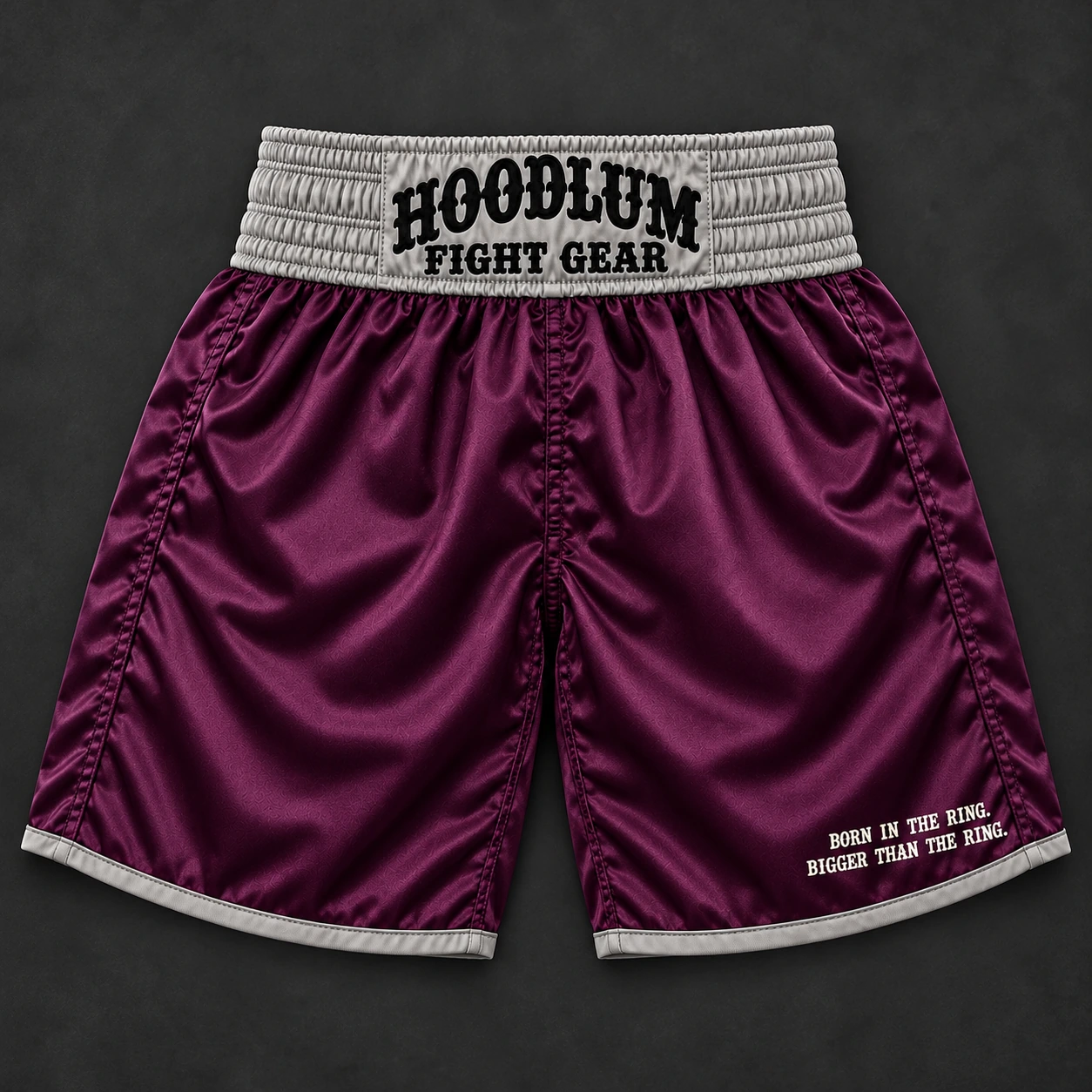 Beyond Ring Boxing Shorts — Plum / Pewter — Flat-lay view (AI demo concept)