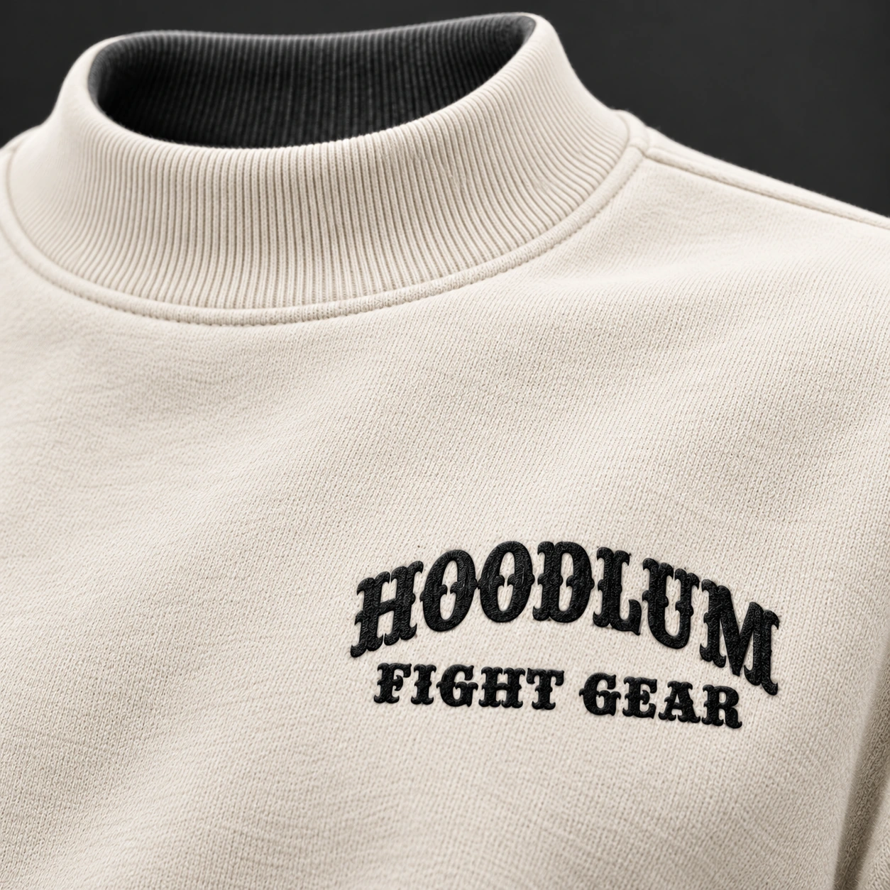 Beyond Ring Mockneck — Bone / Graphite — Branding detail (AI demo concept)