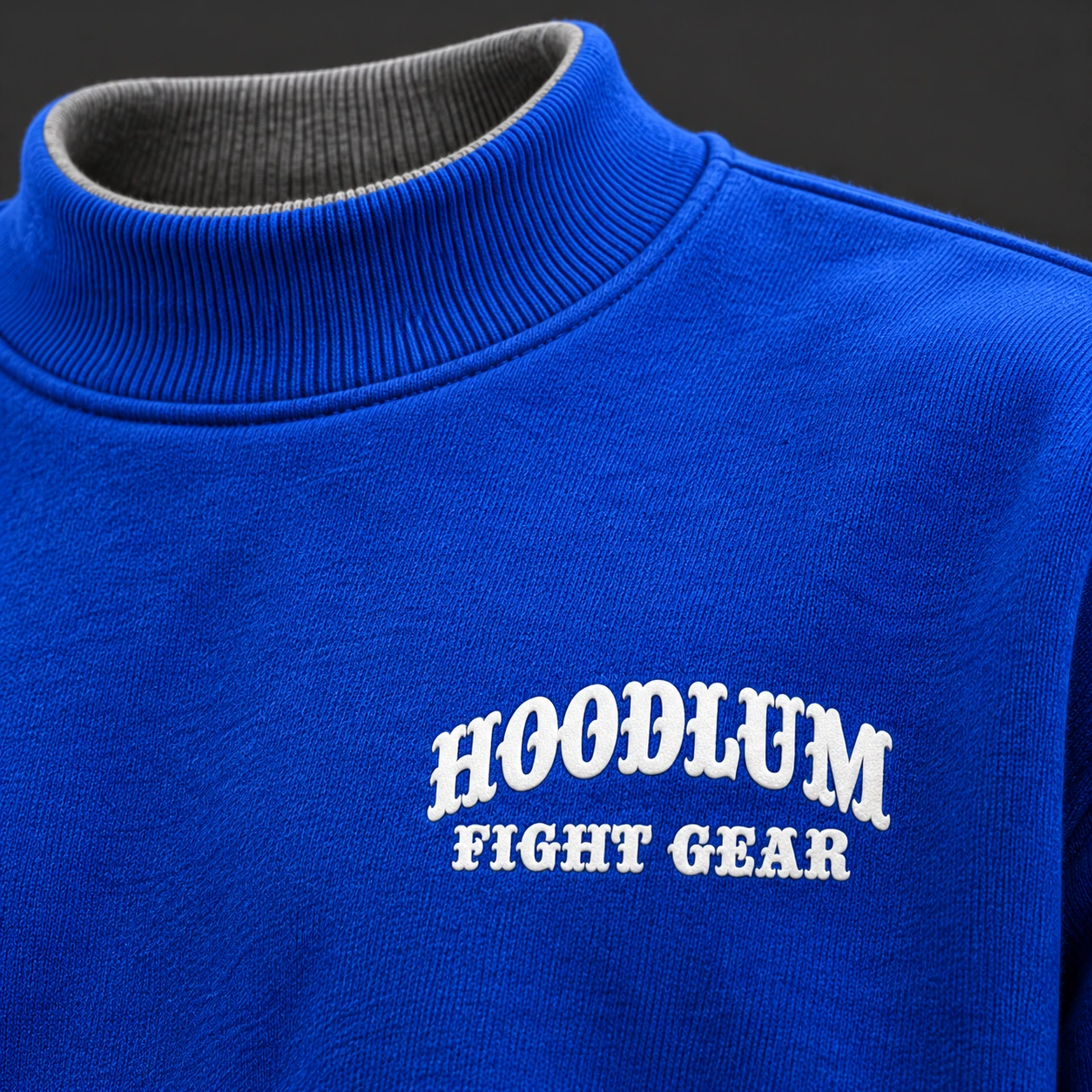 Beyond Ring Mockneck — Cobalt / Steel — Branding detail (AI demo concept)