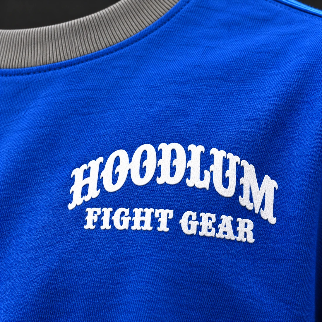 Beyond the Ring Tee — Cobalt / Steel — Branding detail (AI demo concept)