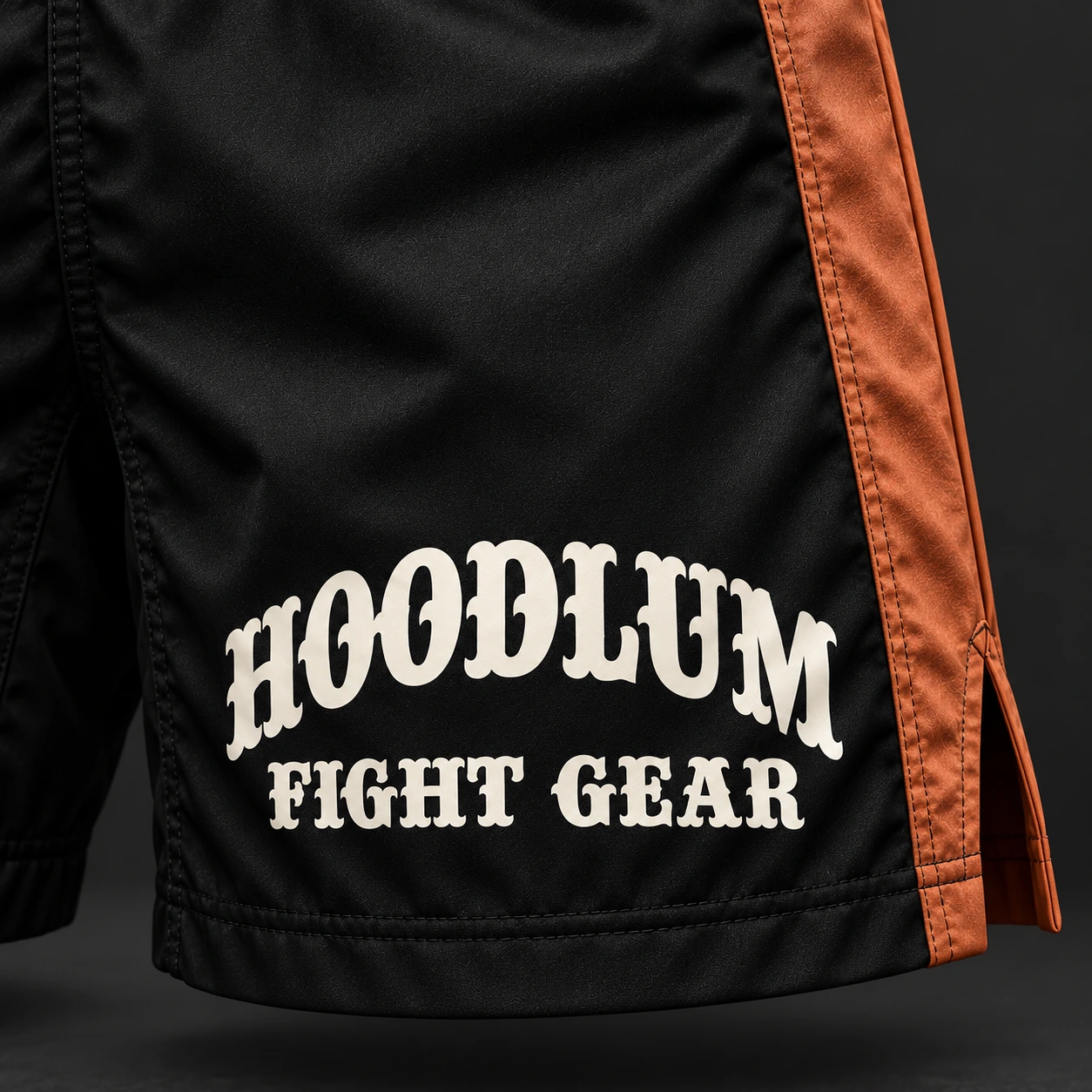 Crimson Corner Shorts — Black / Copper — Branding detail (AI demo concept)
