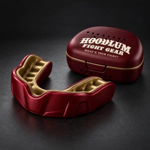 Crimson Mouthguard — Oxblood / Brass — Three-quarter view (AI demo concept)