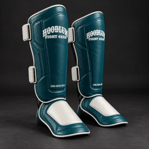 Crimson Shin Guards — Petrol / Chalk — Three-quarter view (AI demo concept)
