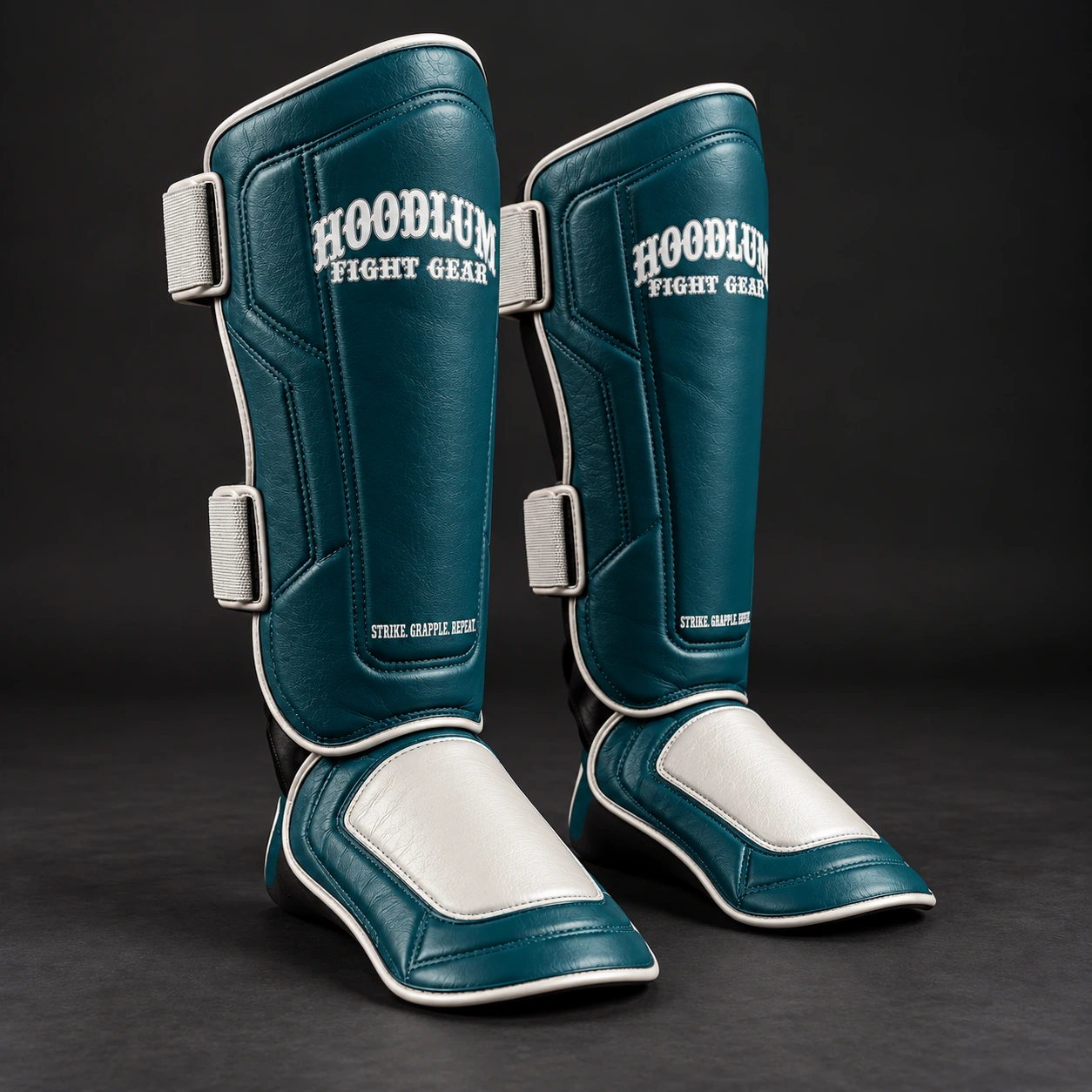 Crimson Shin Guards — Petrol / Chalk — Three-quarter view (AI demo concept)