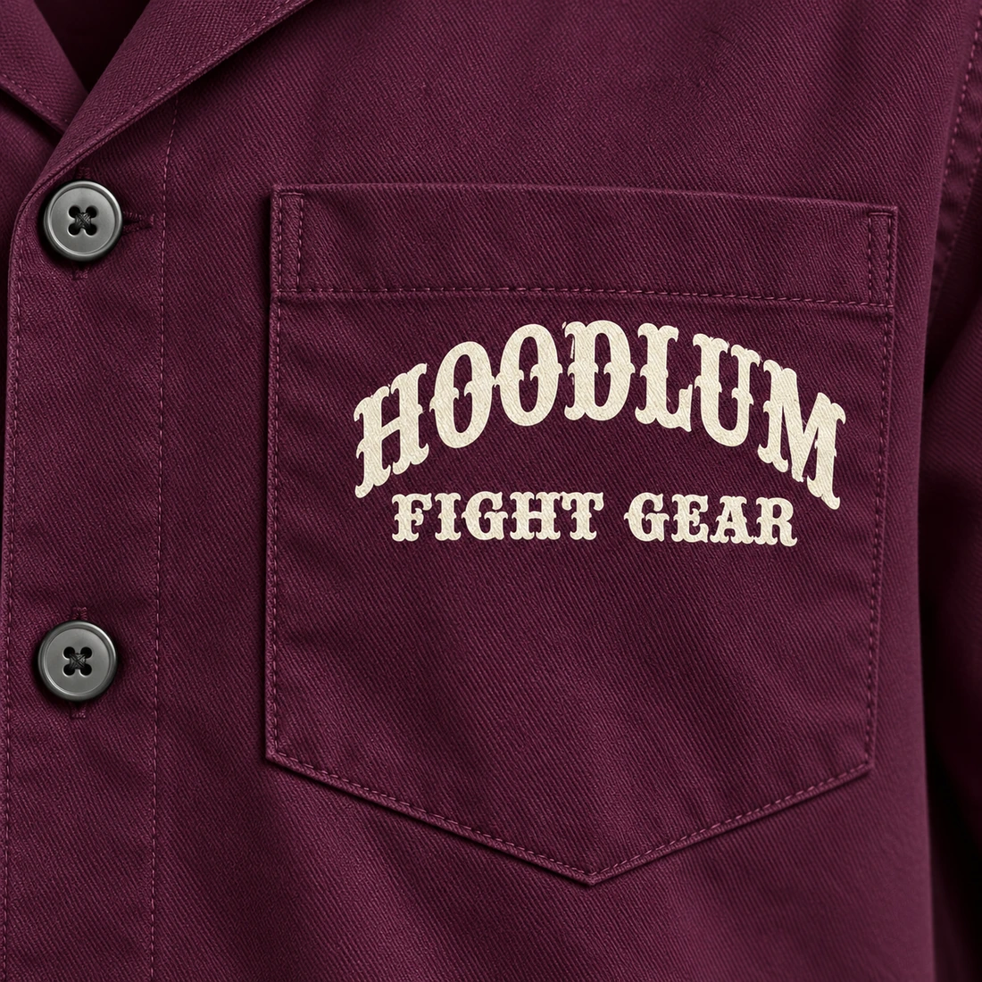 Fight Spirit Camp Shirt — Plum / Pewter — Branding detail (AI demo concept)