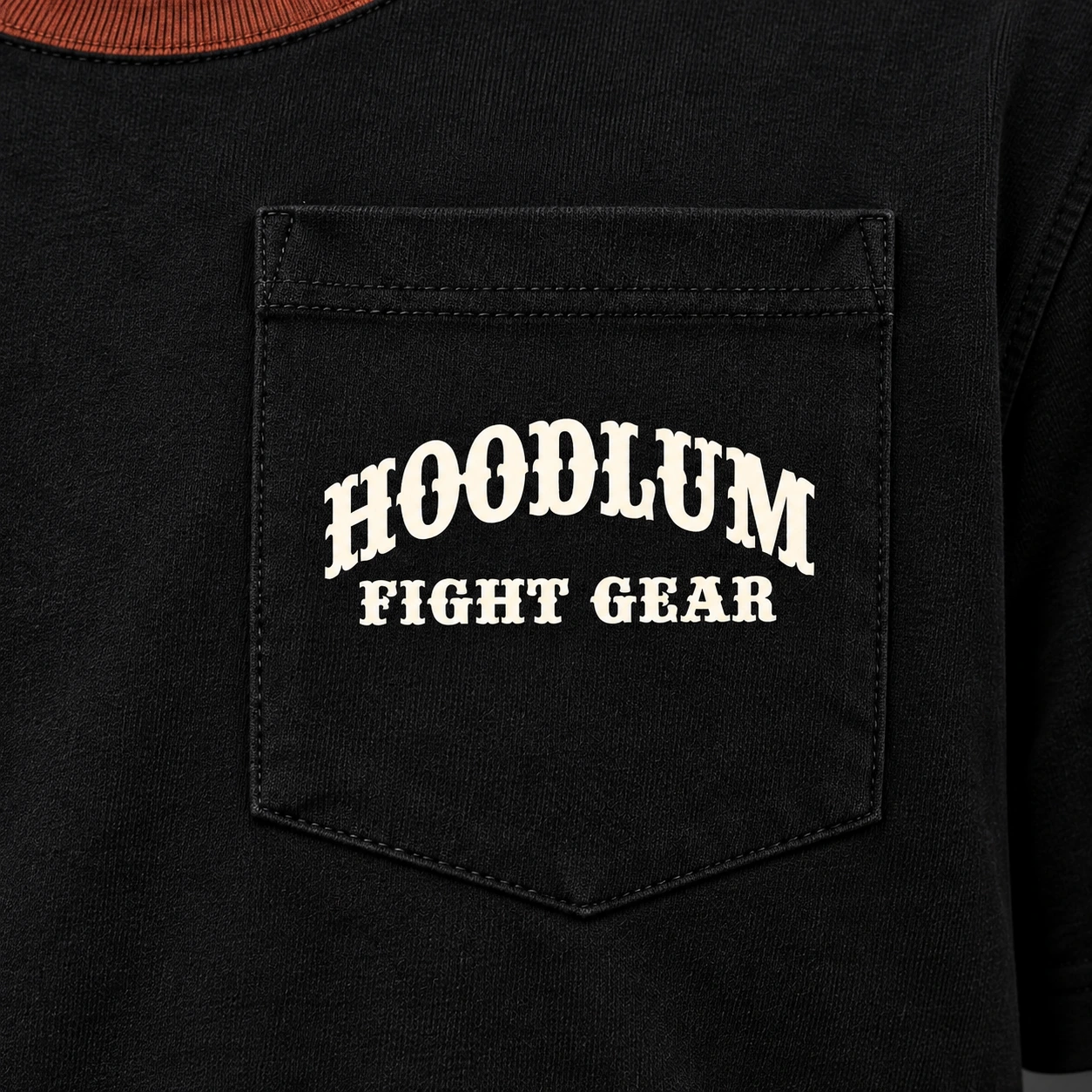 Final Round Pocket Tee — Black / Copper — Branding detail (AI demo concept)