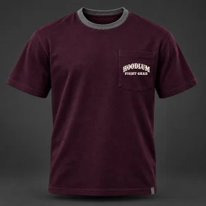 Final Round Pocket Tee — Plum / Pewter — Front view (AI demo concept)