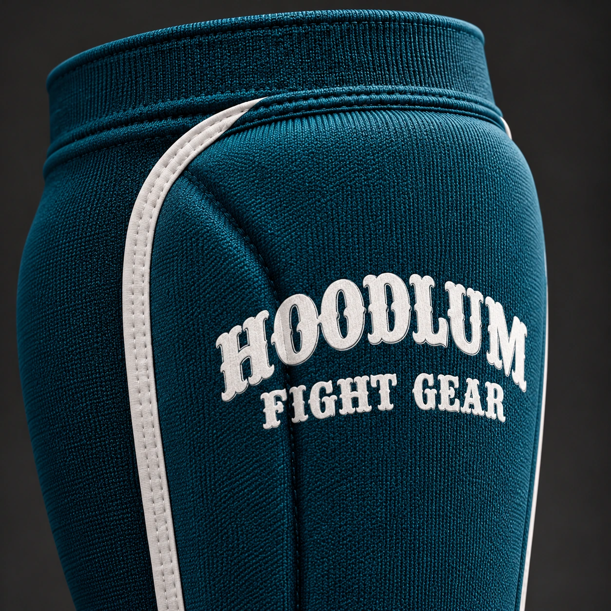 Grappling Shin Sleeves — Petrol / Chalk — Branding detail (AI demo concept)