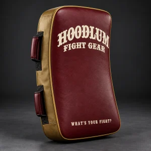Kick Shield — Oxblood / Brass — Three-quarter view (AI demo concept)