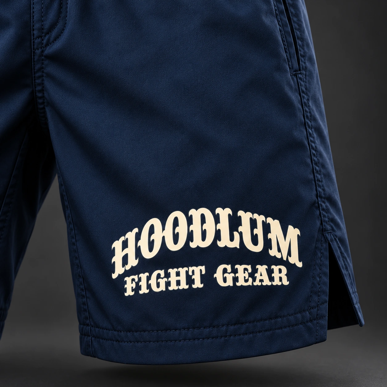 Onyx Fight Shorts — Marine / Bone — Branding detail (AI demo concept)