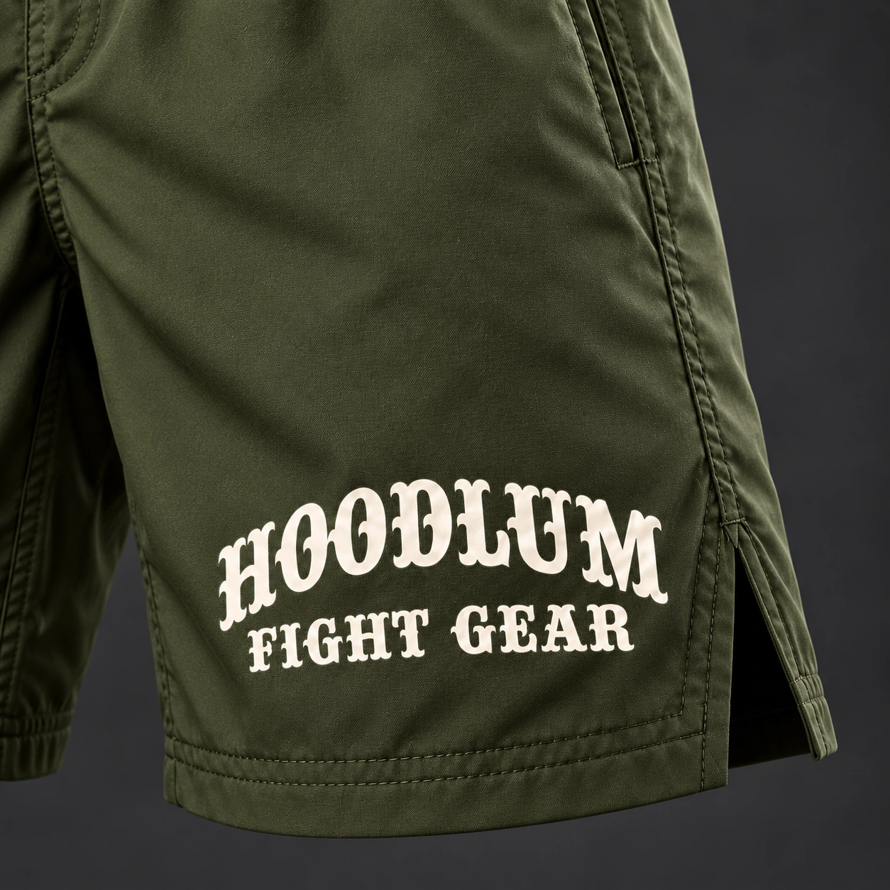 Onyx Fight Shorts — Olive / Carbon — Branding detail (AI demo concept)