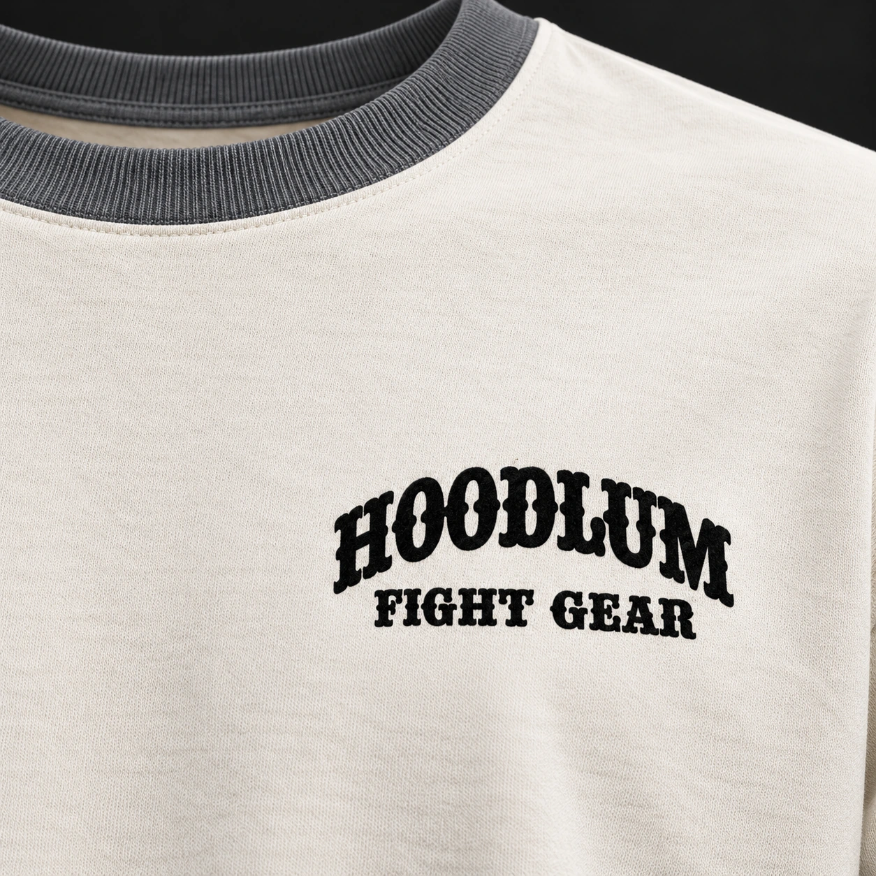 Story Long Sleeve Tee — Bone / Graphite — Branding detail (AI demo concept)