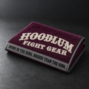 Training Towel — Plum / Pewter — Three-quarter view (AI demo concept)