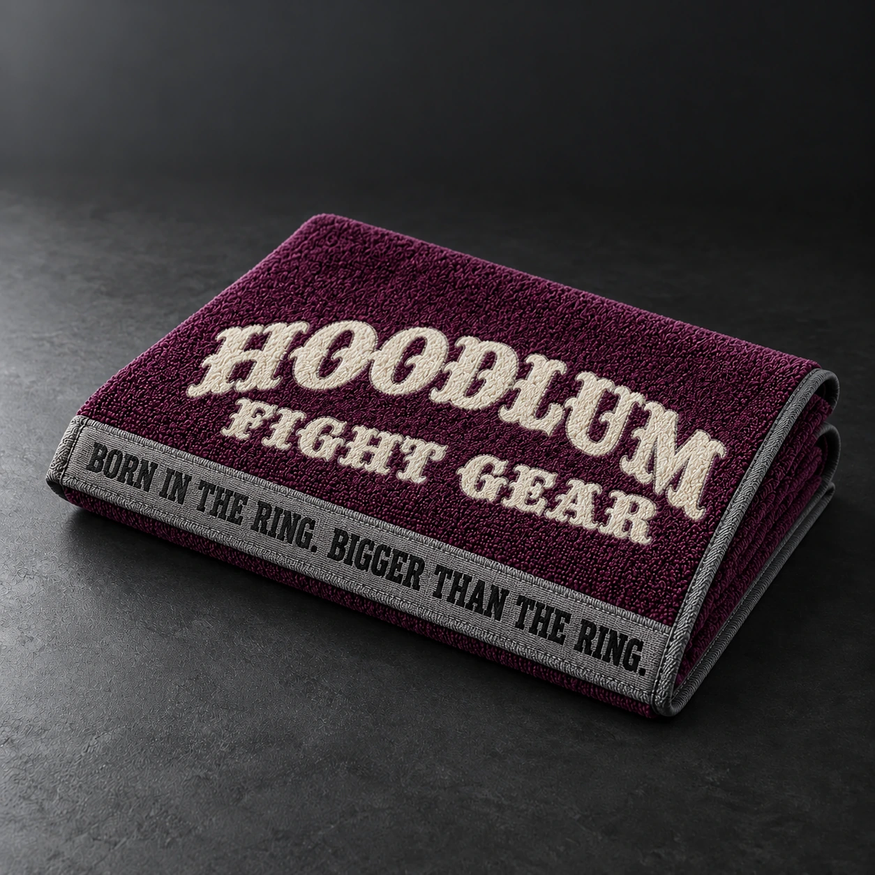 Training Towel — Plum / Pewter — Three-quarter view (AI demo concept)