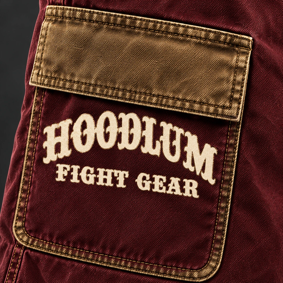Unseen Work Utility Shorts — Oxblood / Brass — Branding detail (AI demo concept)